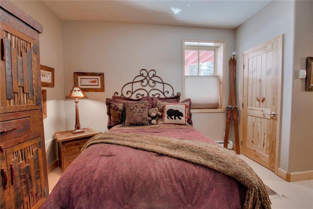 334 D Streamside Lane Frisco, CO 80443 - Photo 31 of 35 a bedroom with a bed and a window