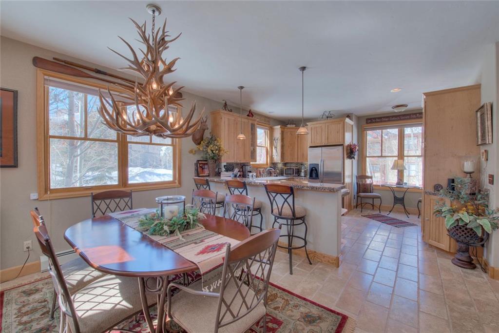 334 D Streamside Lane Frisco, CO 80443 - Photo 8 of 35 a view of a dining room with furniture window and outside view