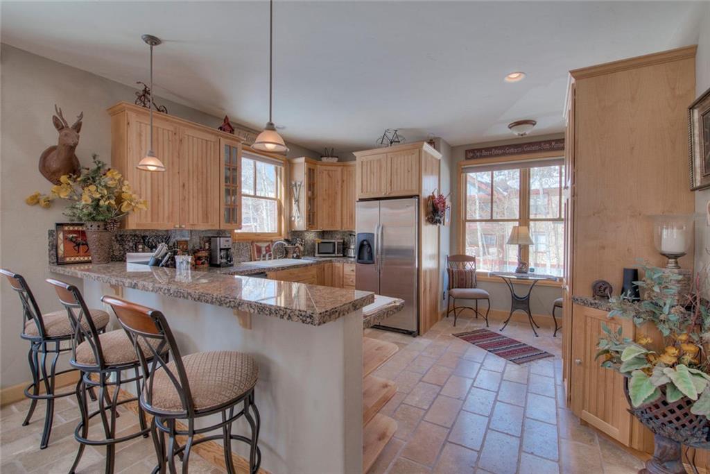 334 D Streamside Lane Frisco, CO 80443 - Photo 9 of 35 a large kitchen with lots of counter space and windows