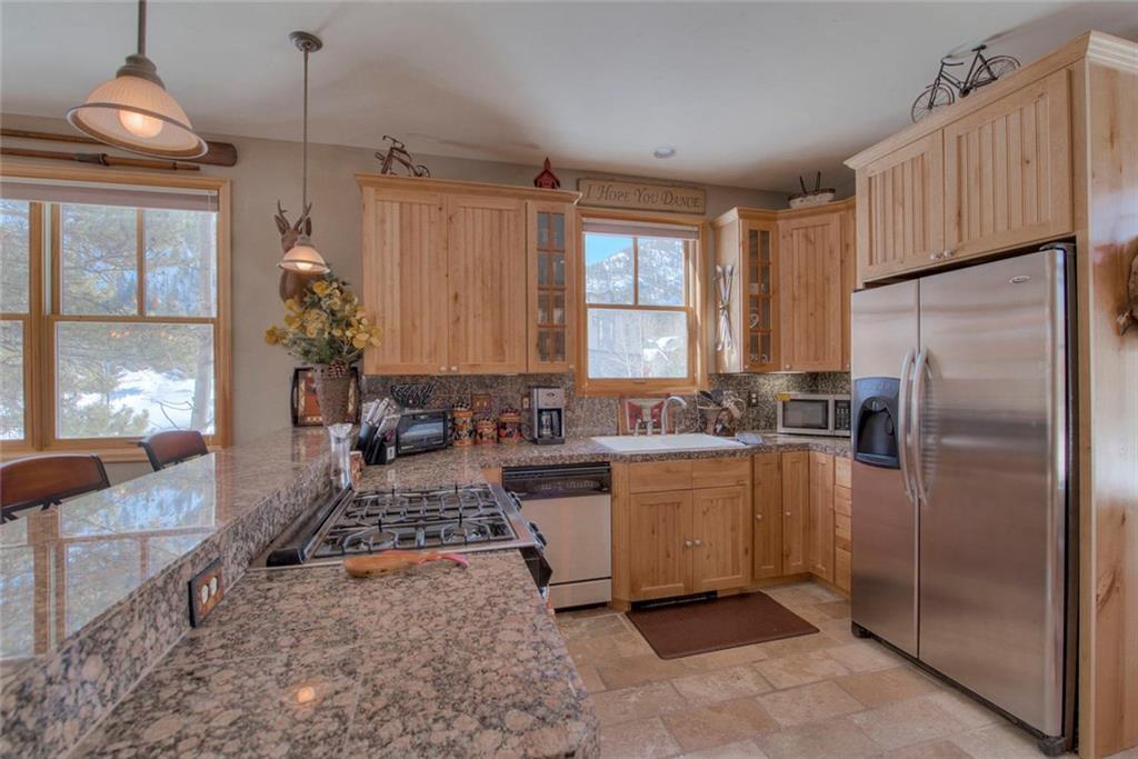 334 D Streamside Lane Frisco, CO 80443 - Photo 10 of 35 a kitchen with sink refrigerator and window