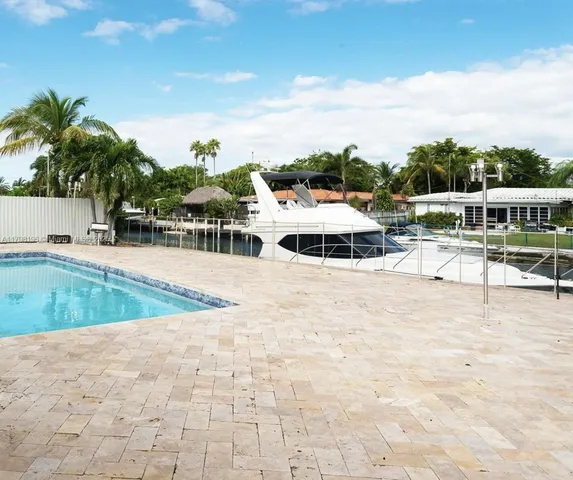 a view of a swimming pool and lounge chair