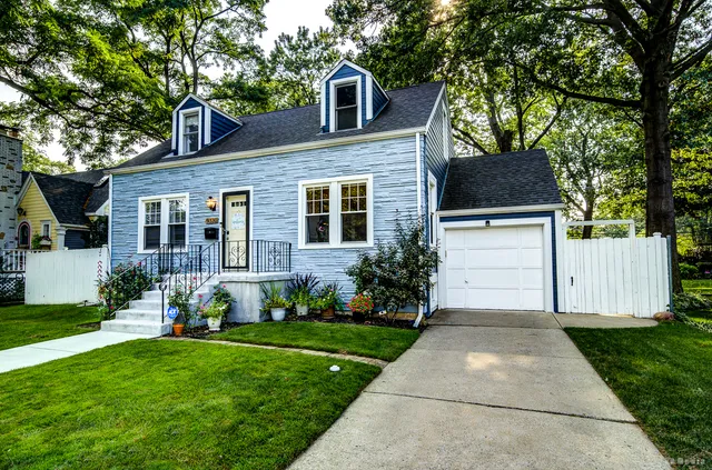 a front view of a house with a yard and porch