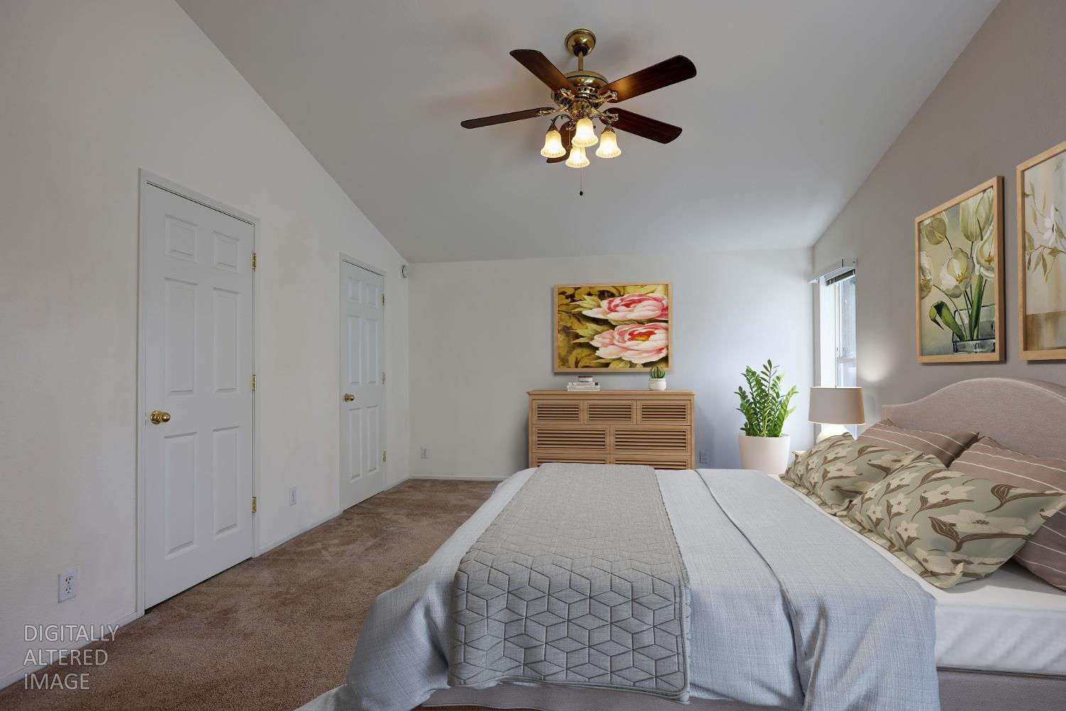 450 Gladycon Road, Unit 83 Colfax, CA 95713 - Photo 13 of 52 a bedroom with a large bed and a chandelier