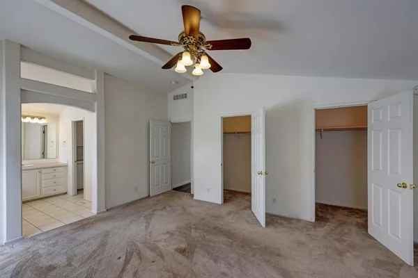 a view of a livingroom with workspace and a window