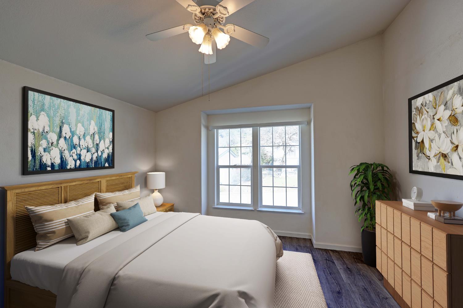 450 Gladycon Road, Unit 83 Colfax, CA 95713 - Photo 17 of 52 a bedroom with a large bed and wooden floor