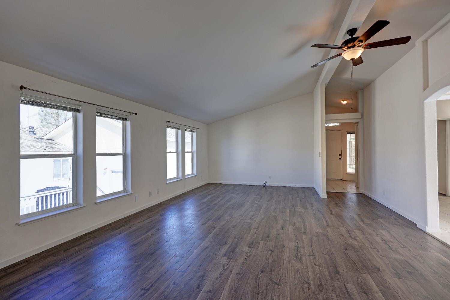 450 Gladycon Road, Unit 83 Colfax, CA 95713 - Photo 36 of 52 a view of an empty room with a window and wooden floor