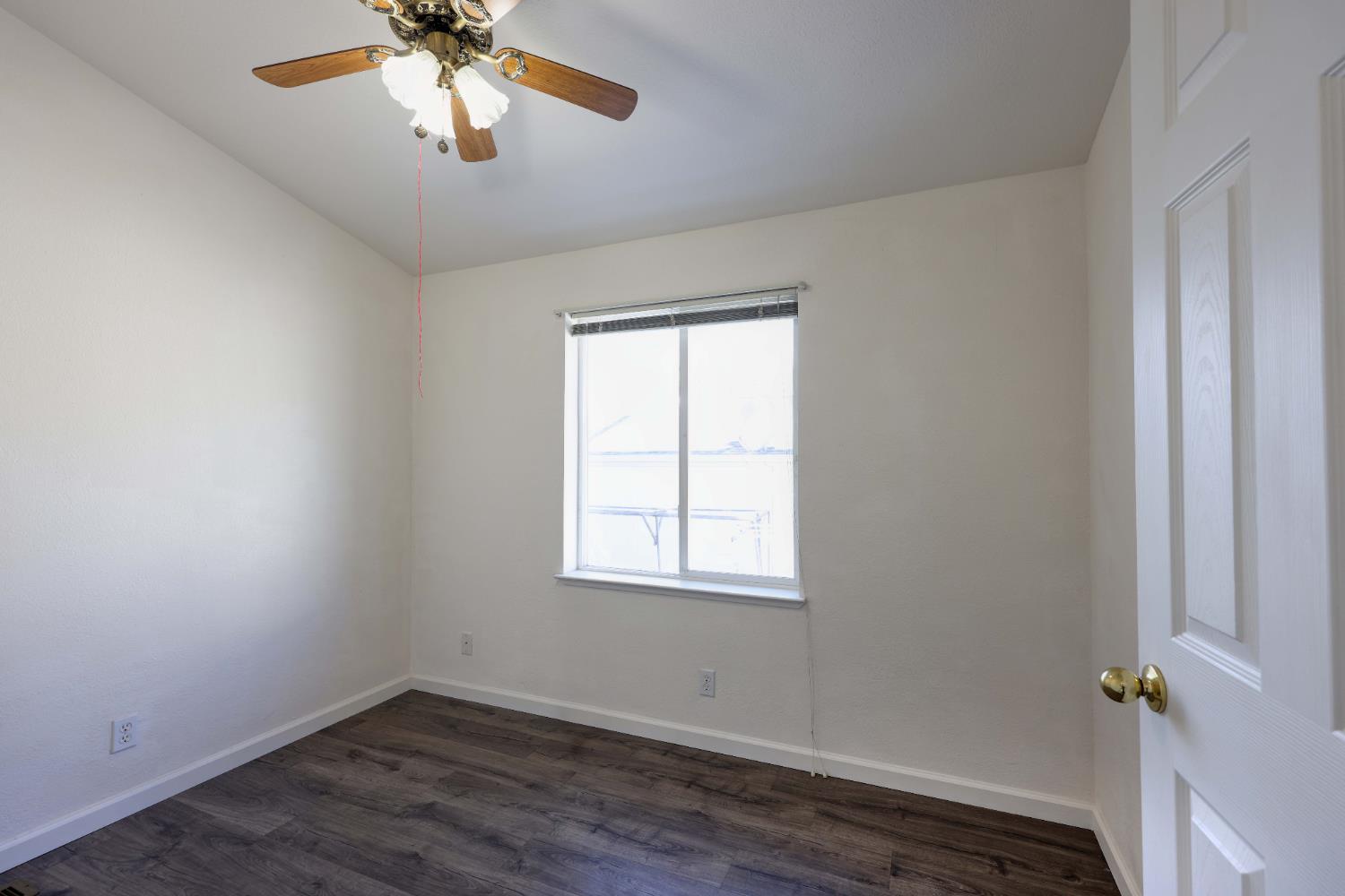 450 Gladycon Road, Unit 83 Colfax, CA 95713 - Photo 43 of 52 an empty room with wooden floor closet and windows