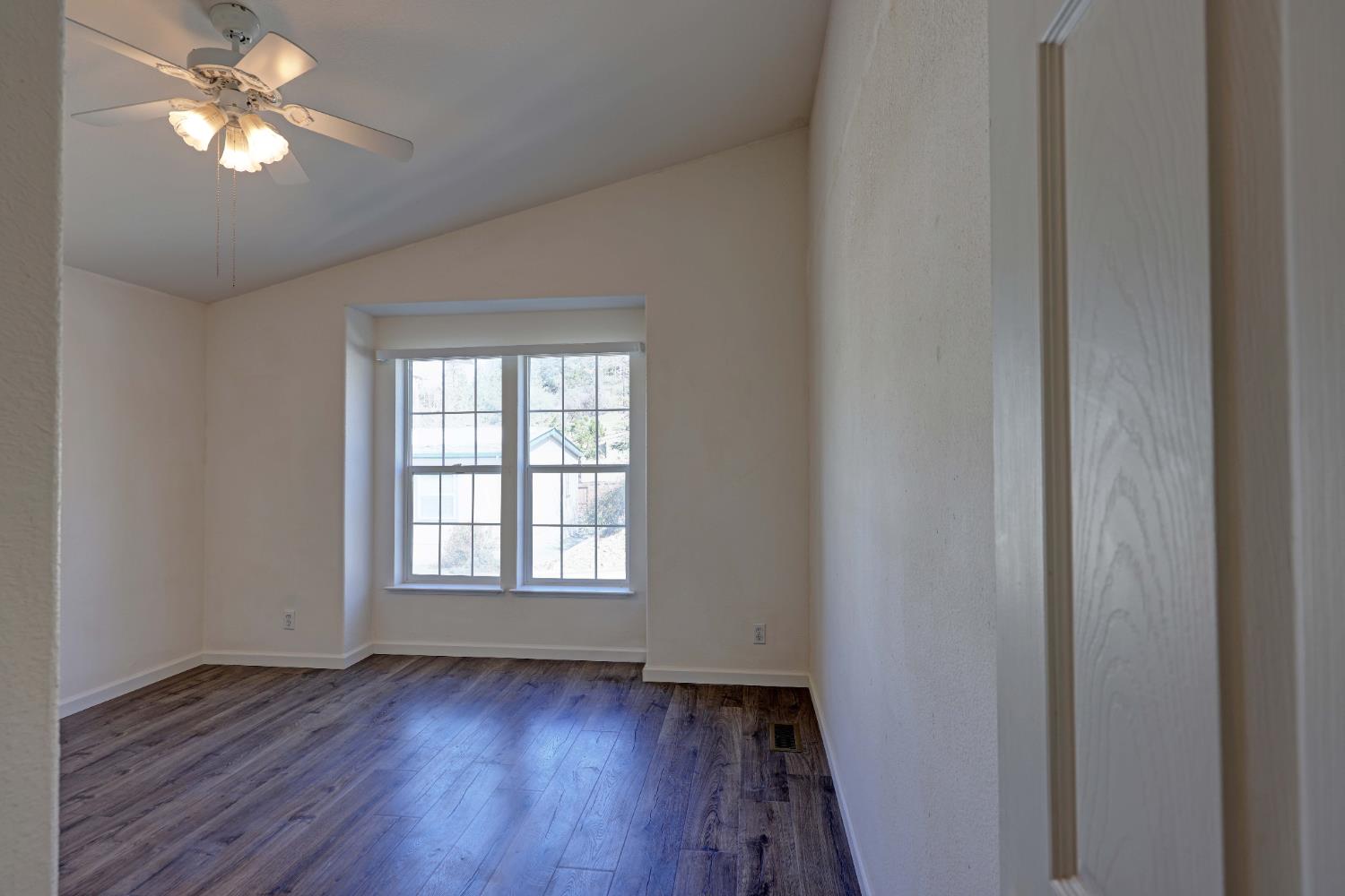 450 Gladycon Road, Unit 83 Colfax, CA 95713 - Photo 52 of 52 a view of empty room with wooden floor and fan