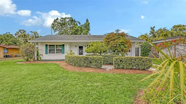 a view of a house with a garden