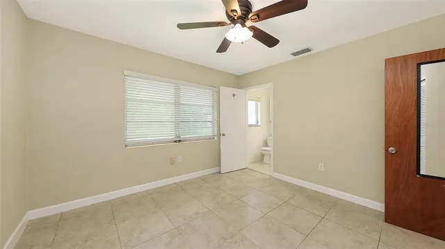a view of a bathroom with a sink and a mirror