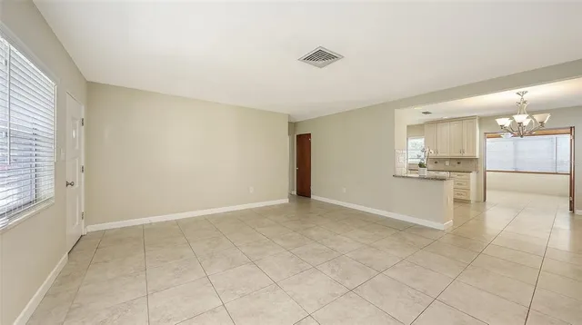 a kitchen with stainless steel appliances granite countertop a refrigerator sink and cabinets