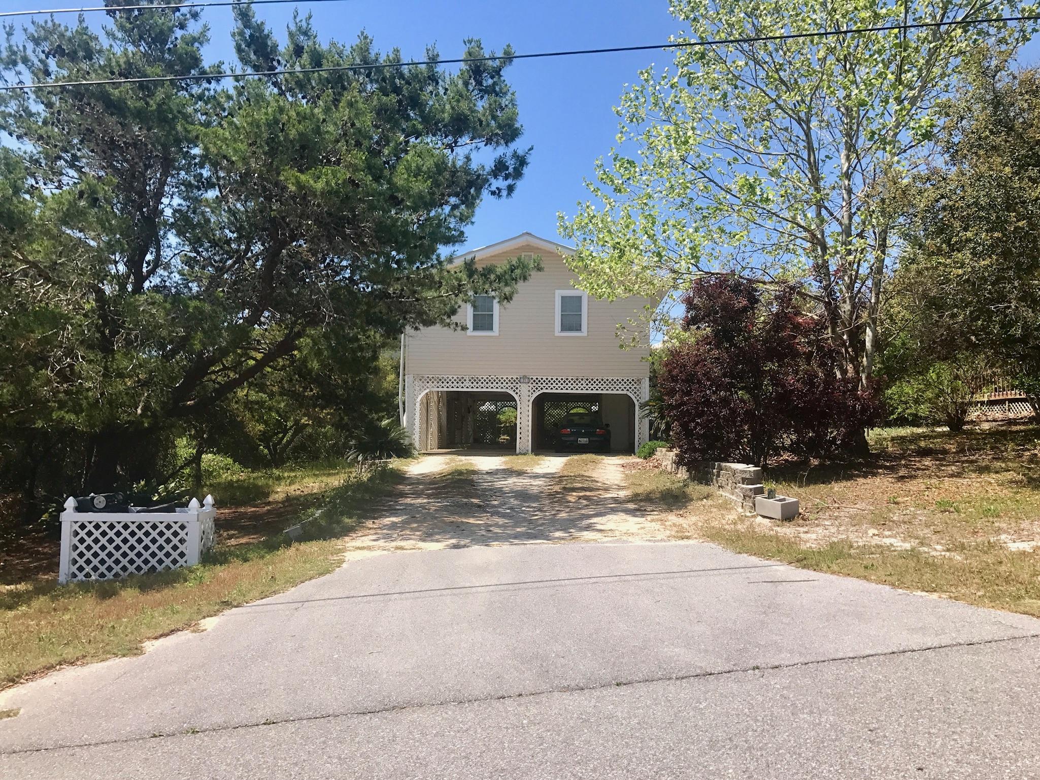71 Baird Road Santa Rosa Beach, FL 32459 - Photo 15 of 16 a view of a house with a snow in the yard