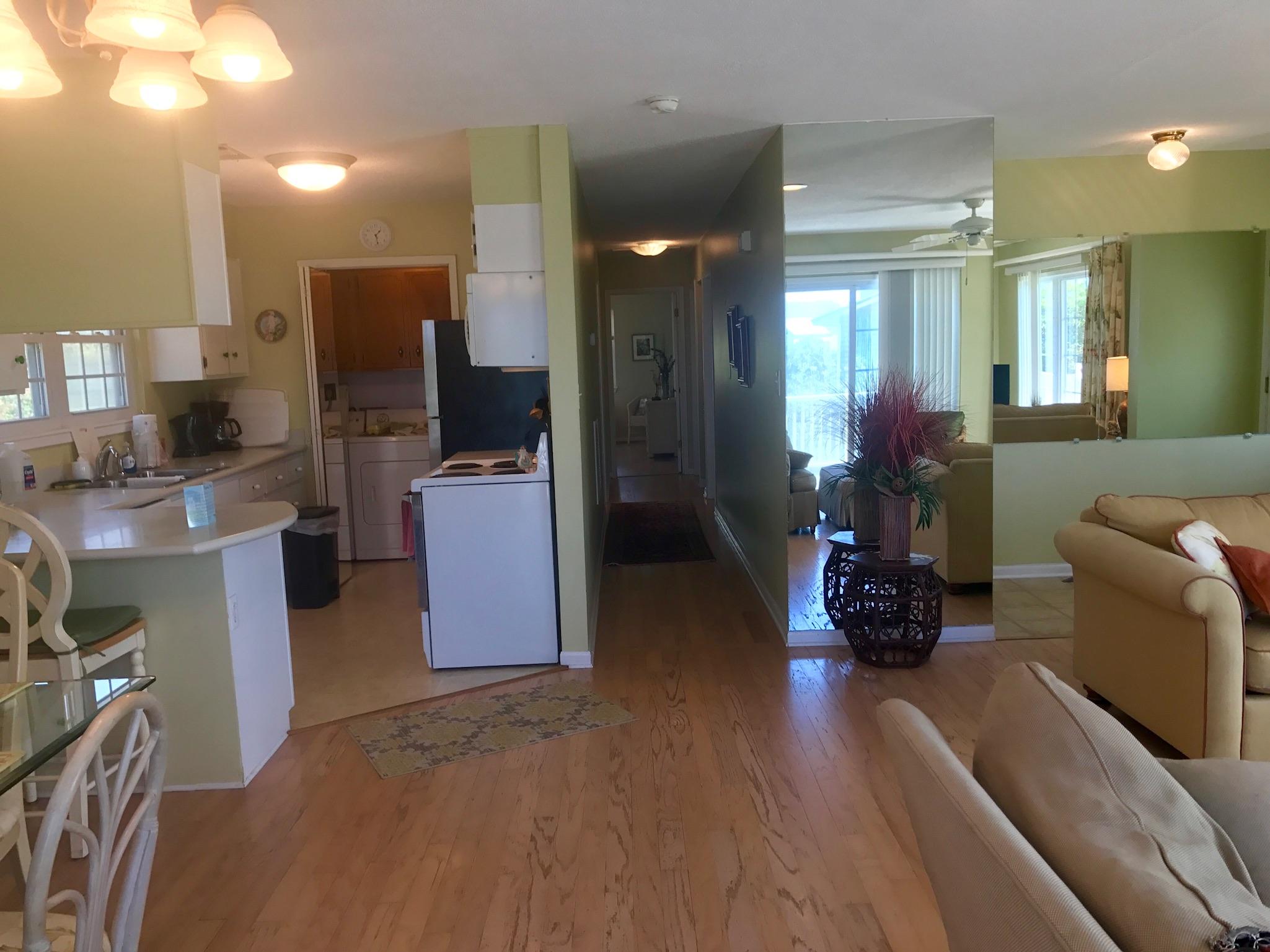 71 Baird Road Santa Rosa Beach, FL 32459 - Photo 6 of 16 a living room with furniture and a wooden floor