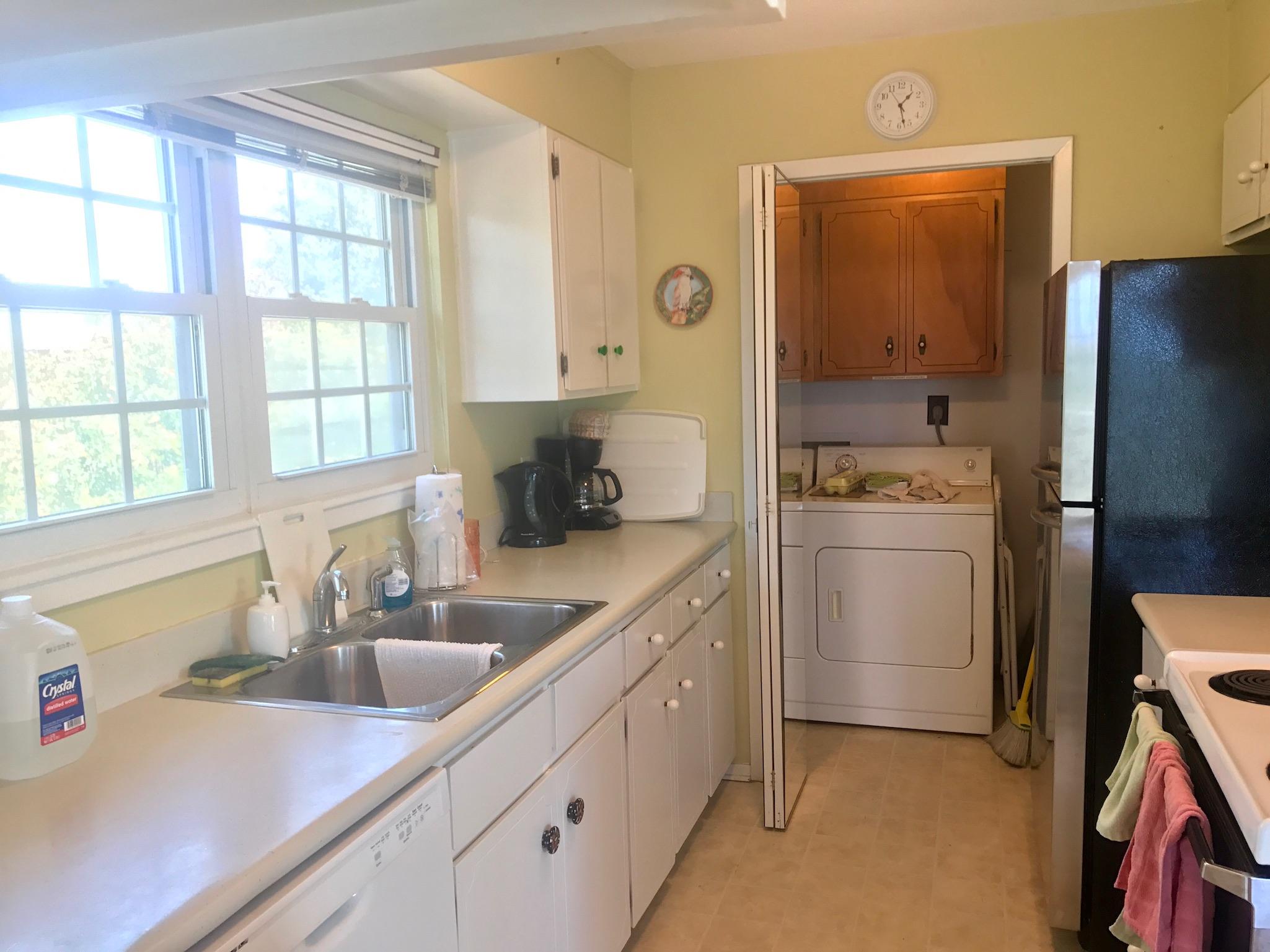 71 Baird Road Santa Rosa Beach, FL 32459 - Photo 8 of 16 a kitchen with a sink cabinets and refrigerator