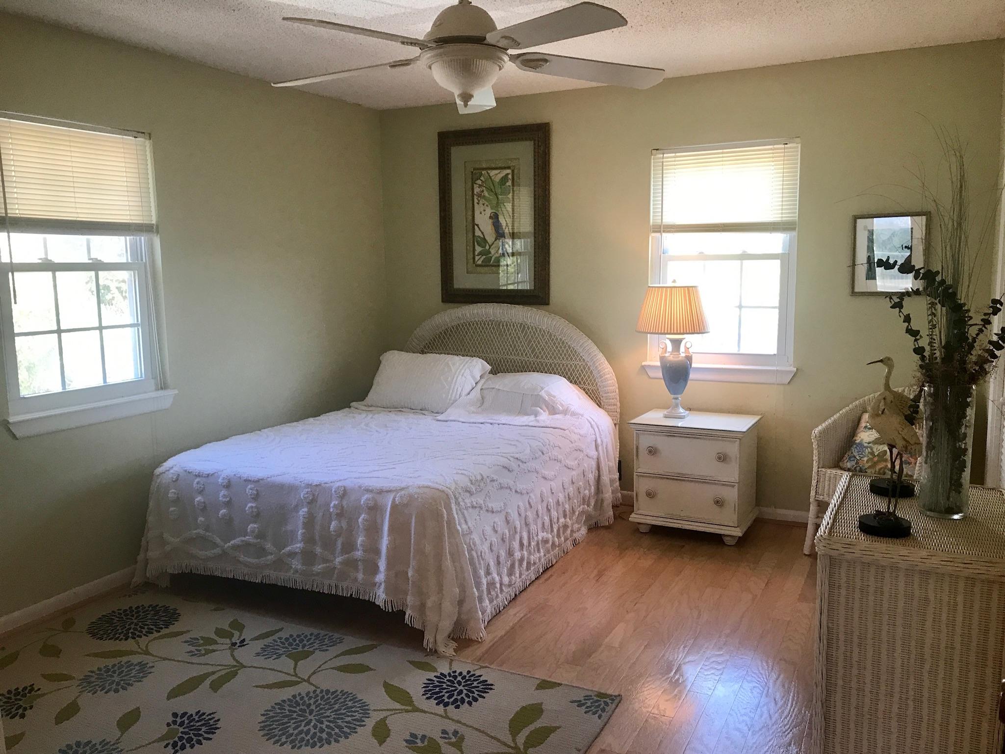 71 Baird Road Santa Rosa Beach, FL 32459 - Photo 9 of 16 a bedroom with a bed and a window