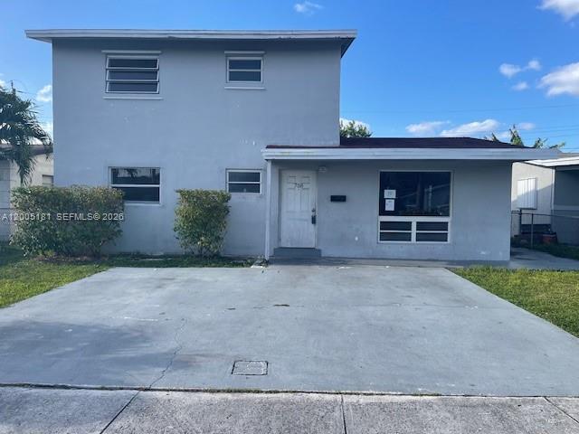 a front view of a house with garage