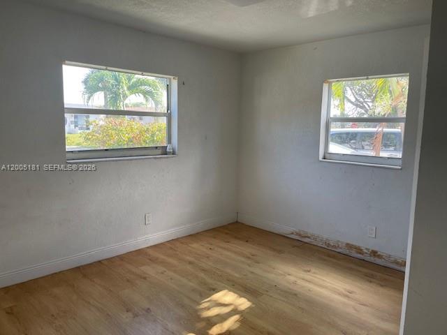 758 Southwest 3rd Place Dania Beach, FL 33004 - Photo 5 of 10 an empty room with a window