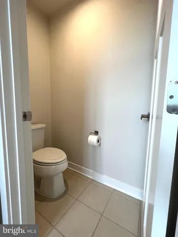 a white toilet sitting next to a sink