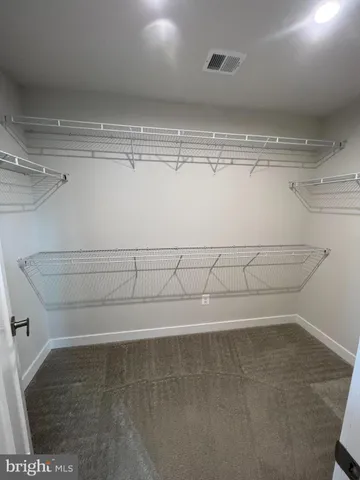 a view of a room with racks on the wall