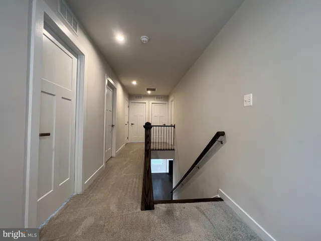 a view of a hallway with staircase