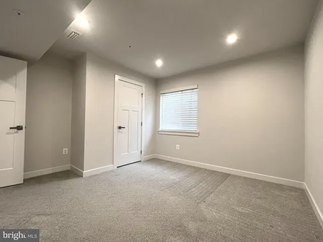 a bathroom with a double vanity sink toilet and a mirror