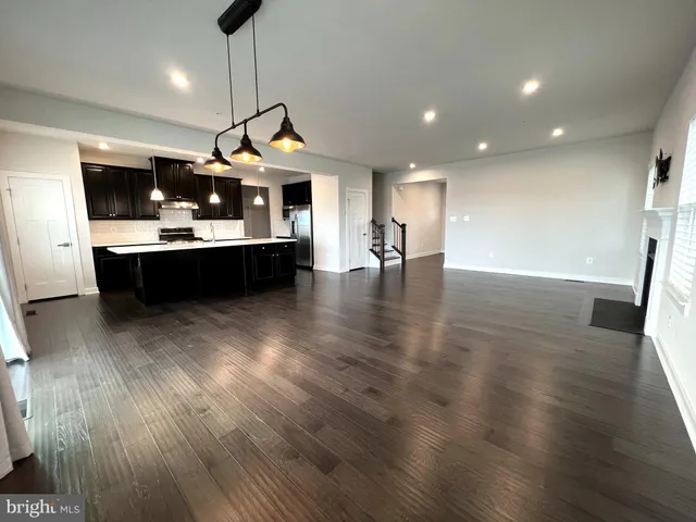 a view of dining room with furniture and wooden floor