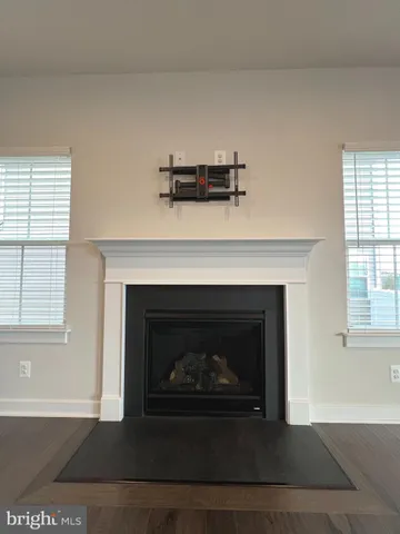 a living room with a fireplace and a fireplace
