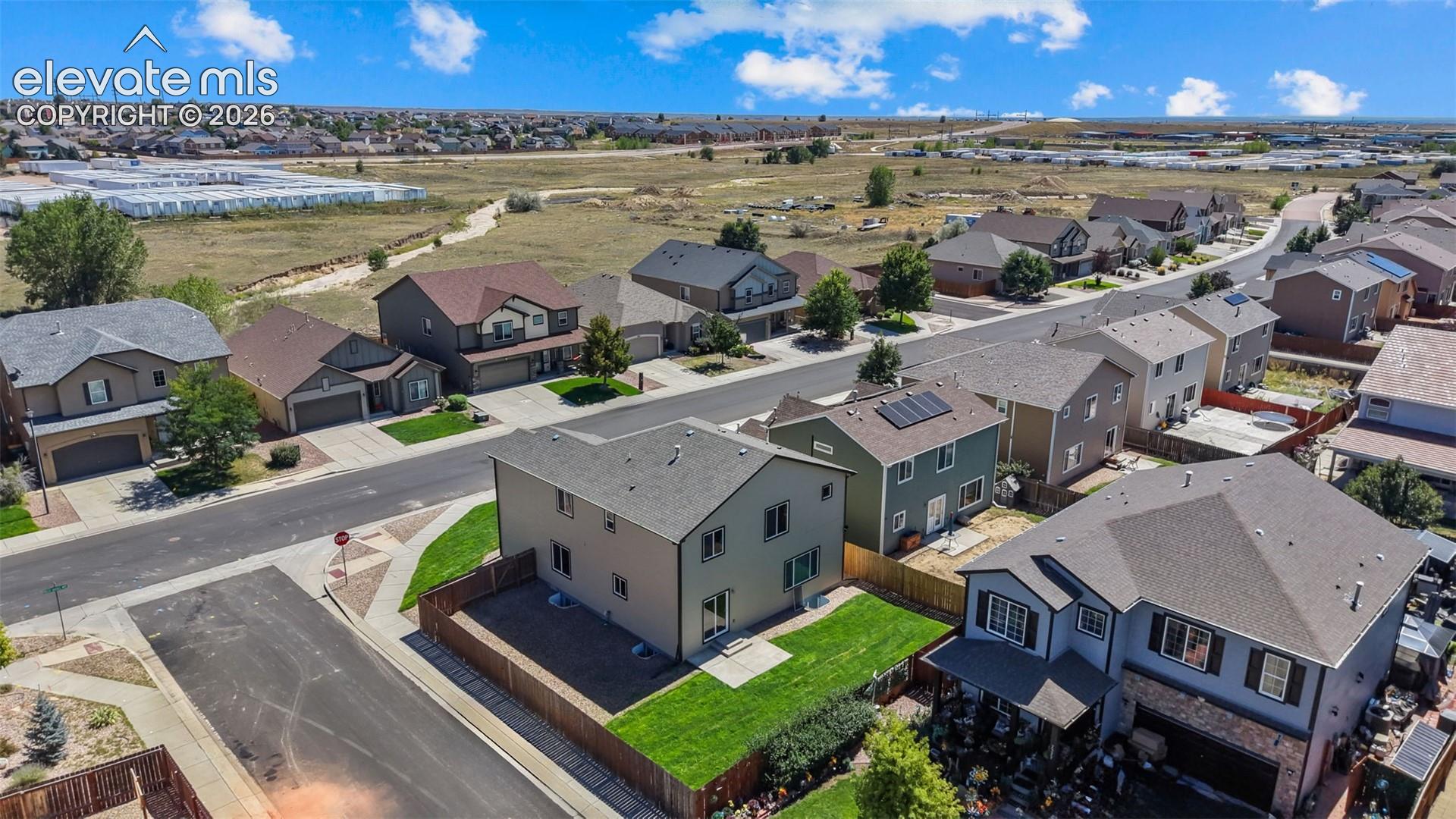 2044 Reed Grass Way Colorado Springs, CO 80915 - Photo 42 of 47 Residential street with uniform housing styles and varied exterior finishes
