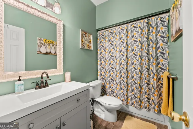 a view of a house with a yard covered in snow