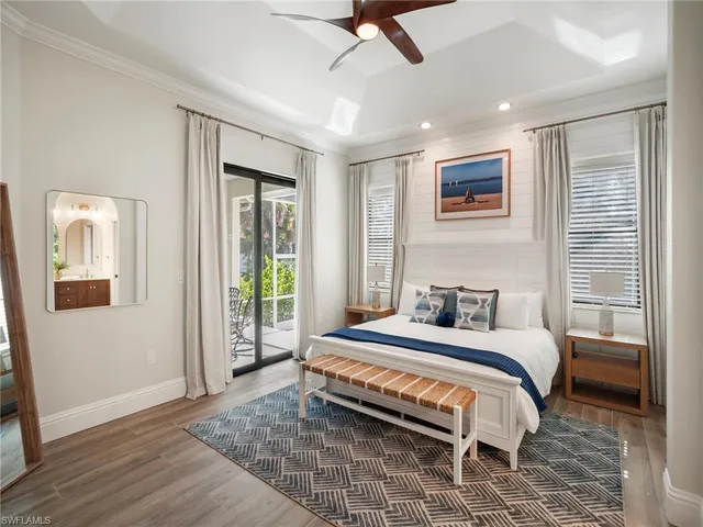 a hallway with a couches and a flat screen tv