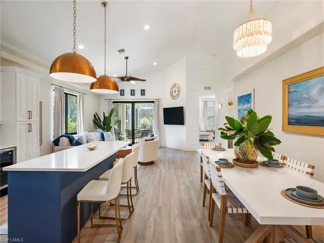 a very nice looking dining room with a table and chairs