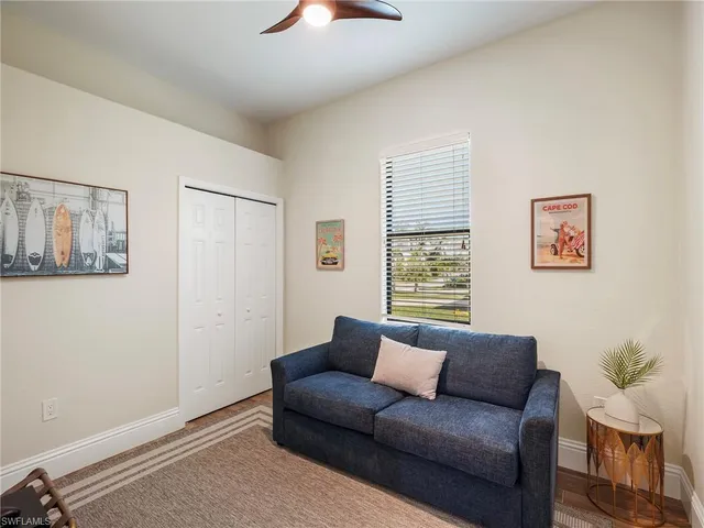a bathroom with a granite countertop sink mirror vanity and toilet