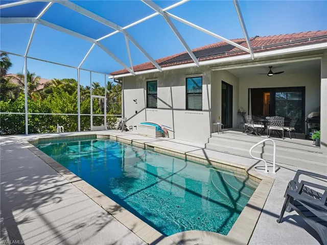 a view of a swimming pool with a patio