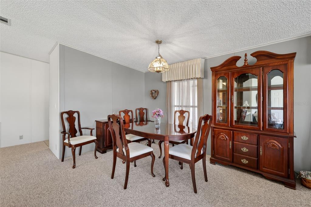 3211 Wekiva Road Tavares, FL 32778 - Photo 21 of 39 a dining room with furniture and window