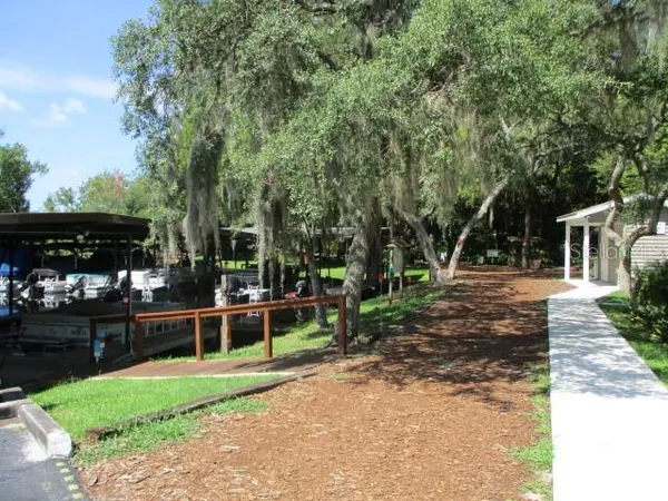 a view of a backyard with sitting area