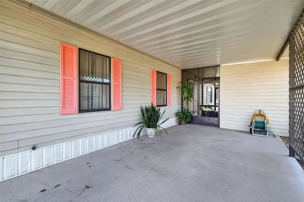 a view of a porch with seating space