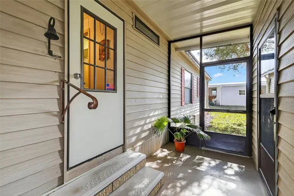 a view of potted plant in front of a door