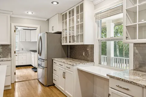a kitchen with a refrigerator and a sink