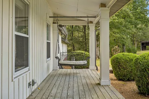 a view of a balcony with wooden floor