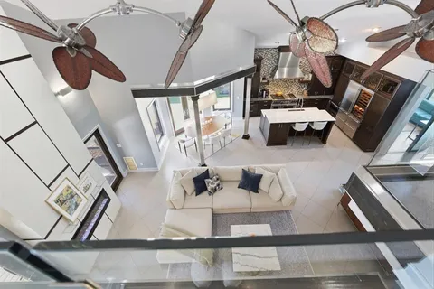an aerial view of residential houses with outdoor space
