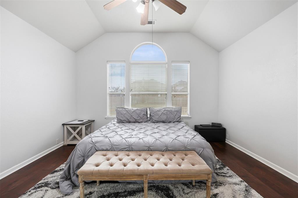 1801 Rim Rock Trail Mansfield, TX 76063 - Photo 17 of 40 a bedroom with a bed and a window