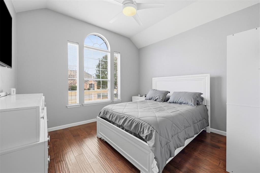 1801 Rim Rock Trail Mansfield, TX 76063 - Photo 22 of 40 a bedroom with a bed and a window