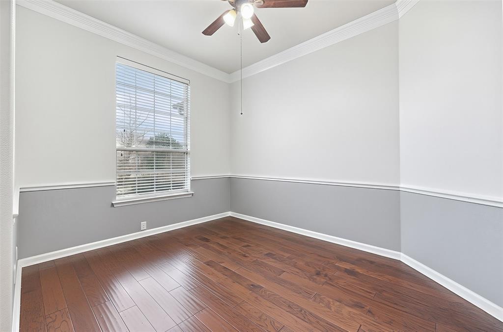 1801 Rim Rock Trail Mansfield, TX 76063 - Photo 24 of 40 an empty room with wooden floor and windows