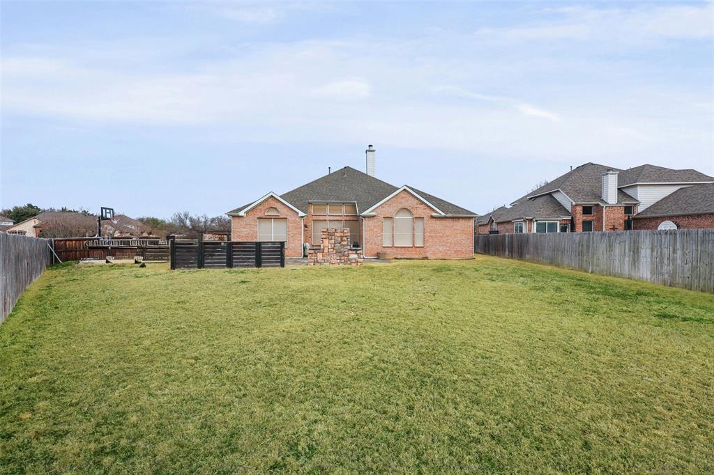 1801 Rim Rock Trail Mansfield, TX 76063 - Photo 32 of 40 a view of a house next to a big yard and large trees