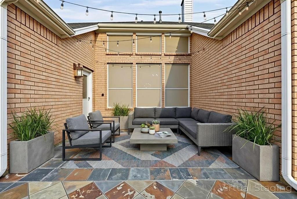 1801 Rim Rock Trail Mansfield, TX 76063 - Photo 33 of 40 a view of a patio with couches and potted plants