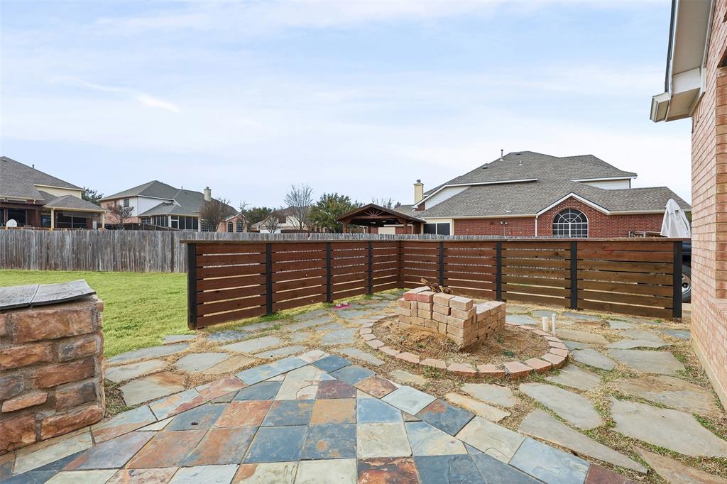 1801 Rim Rock Trail Mansfield, TX 76063 - Photo 34 of 40 a view of a terrace with a table and chairs