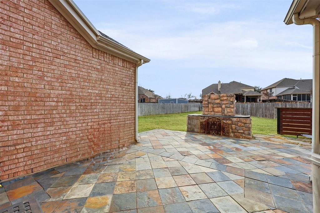 1801 Rim Rock Trail Mansfield, TX 76063 - Photo 36 of 40 a view of a terrace with a chair and floor to ceiling window