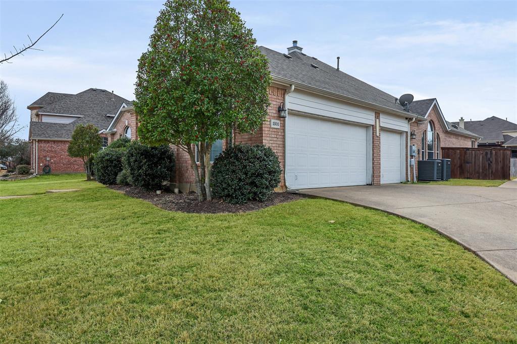 1801 Rim Rock Trail Mansfield, TX 76063 - Photo 39 of 40 a front view of a house with a yard and garage