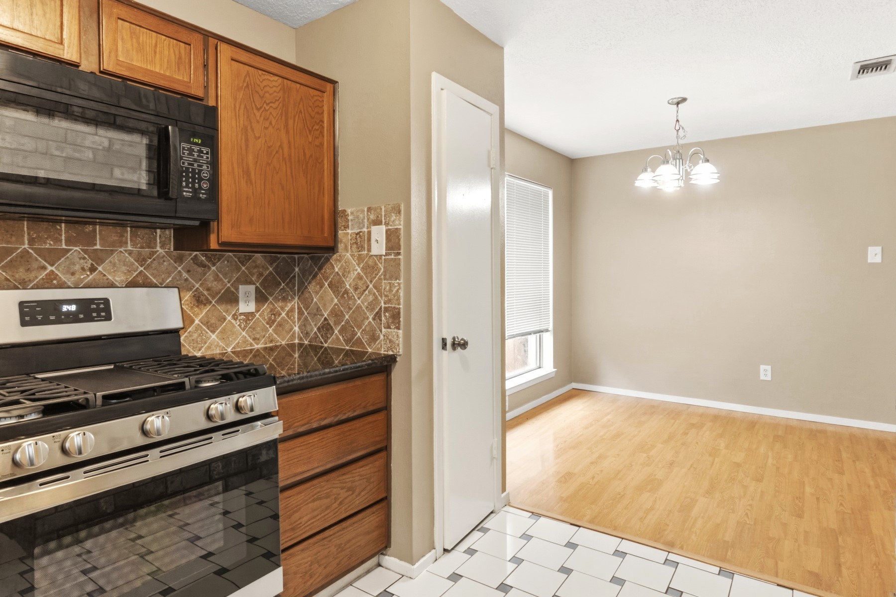 2531 North Spring Drive Spring, TX 77373 - Photo 11 of 24 a kitchen with a stove and a microwave