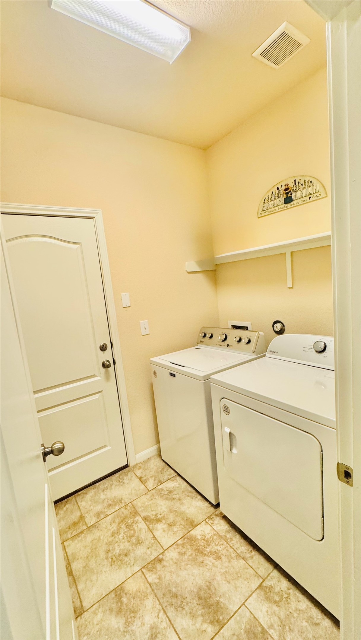 413 Gettysburg Loop Elgin, TX 78621 - Photo 19 of 32 Laundry room featuring washing machine and dryer